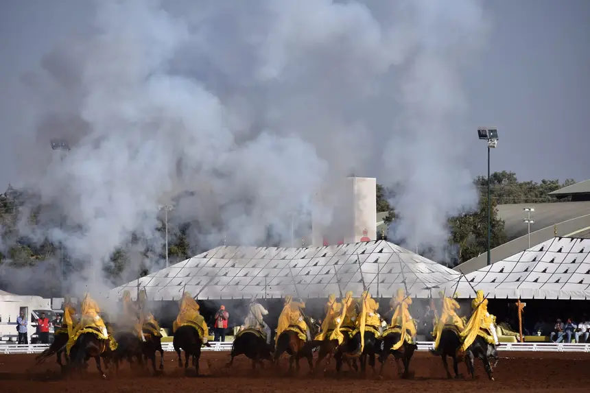 Tbourida fantasia print — Moroccan horsemen charging through gunpowder smoke (BWK-282), photograph by Saida
