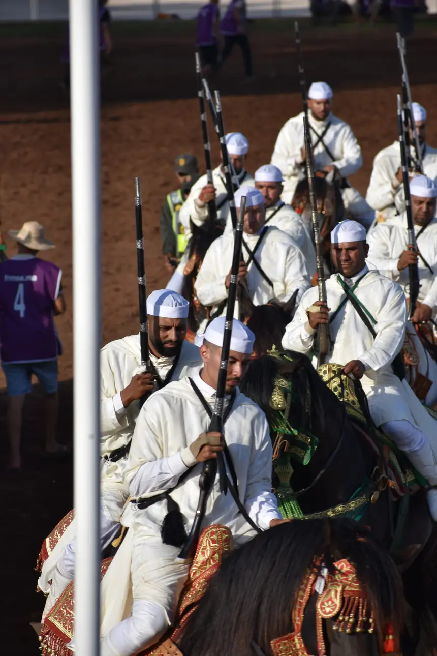 Tbourida fantasia print — Moroccan horsemen charging through gunpowder smoke (BWK-321), photograph by Saida