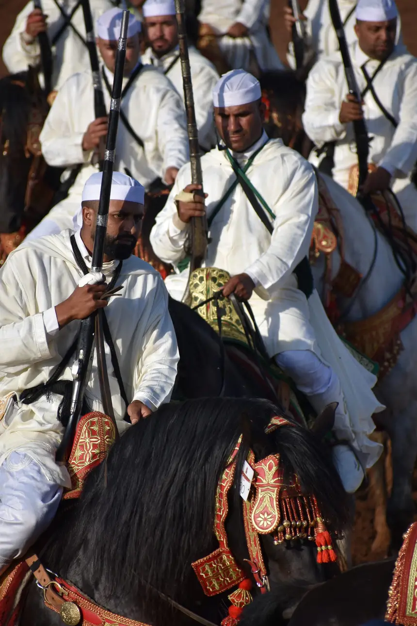 Tbourida fantasia print — Moroccan horsemen charging through gunpowder smoke (BWK-322), photograph by Saida