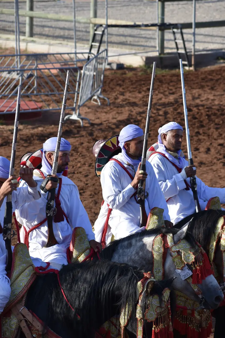 Tbourida fantasia print — Moroccan horsemen charging through gunpowder smoke (BWK-325), photograph by Saida