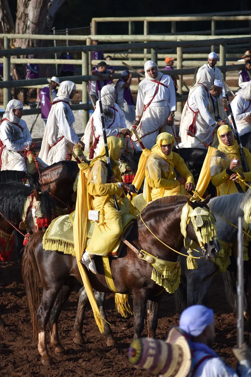 Tbourida fantasia print — Moroccan horsemen charging through gunpowder smoke (BWK-326), photograph by Saida