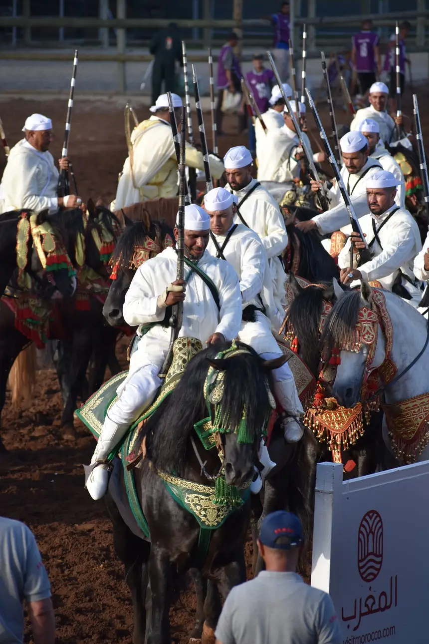 Tbourida fantasia print — Moroccan horsemen charging through gunpowder smoke (BWK-353), photograph by Saida