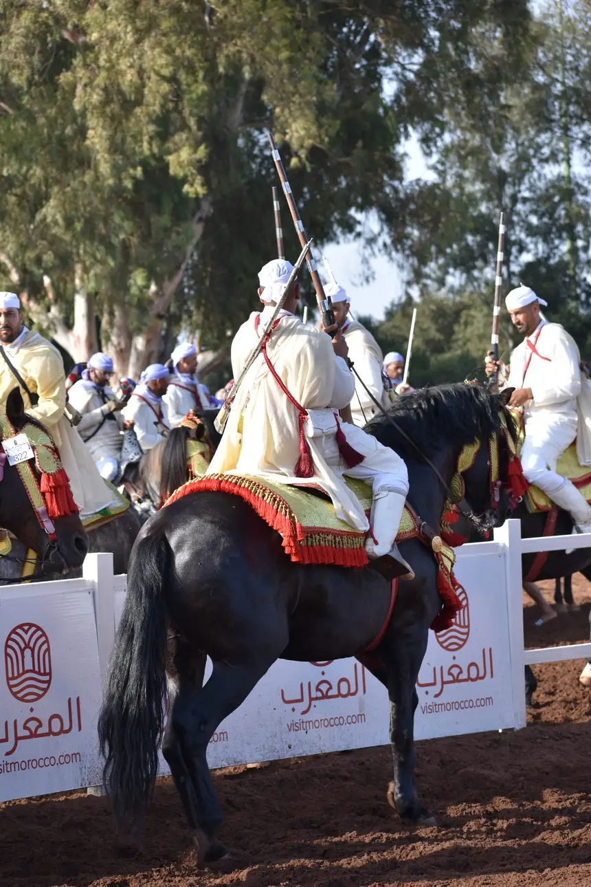Tbourida fantasia print — Moroccan horsemen charging through gunpowder smoke (BWK-366), photograph by Saida