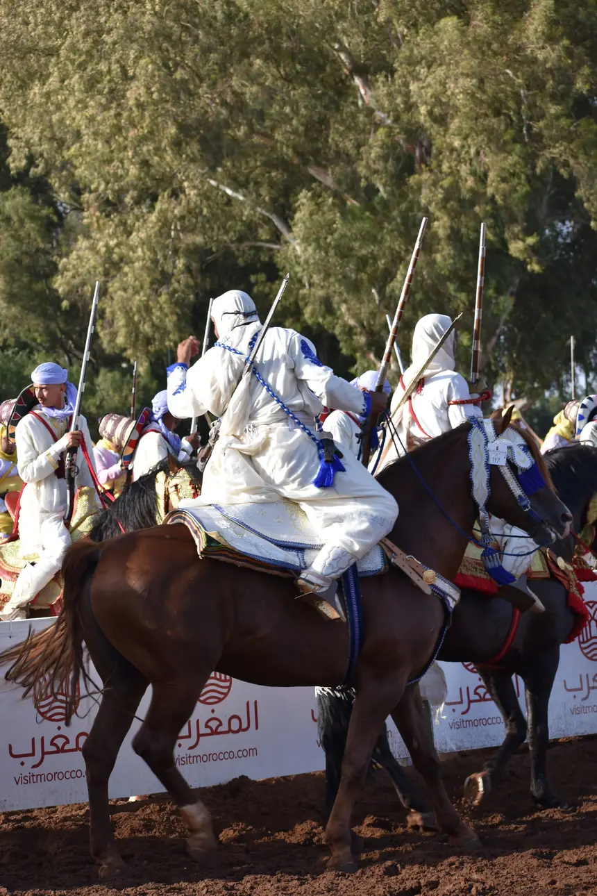 Tbourida fantasia print — Moroccan horsemen charging through gunpowder smoke (BWK-374), photograph by Saida