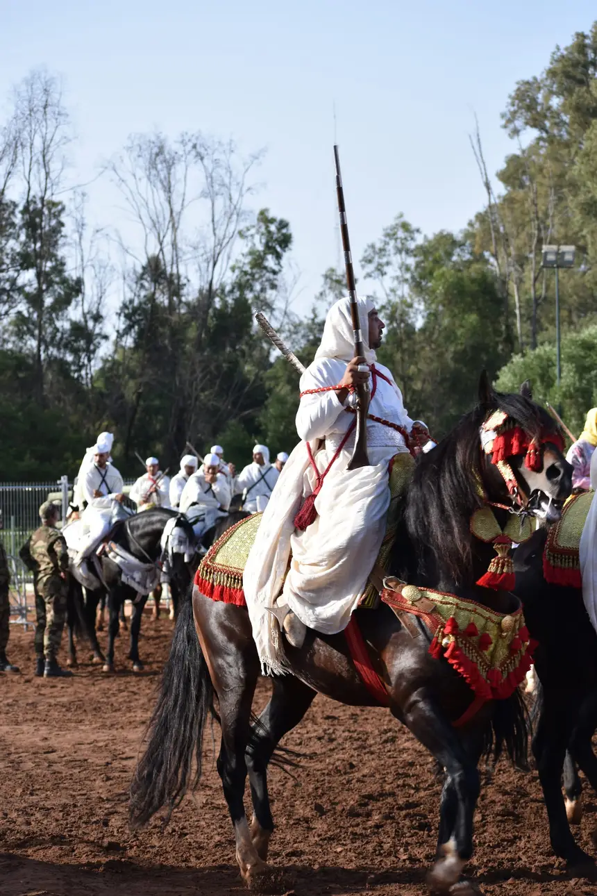 Tbourida fantasia print — Moroccan horsemen charging through gunpowder smoke (BWK-375), photograph by Saida