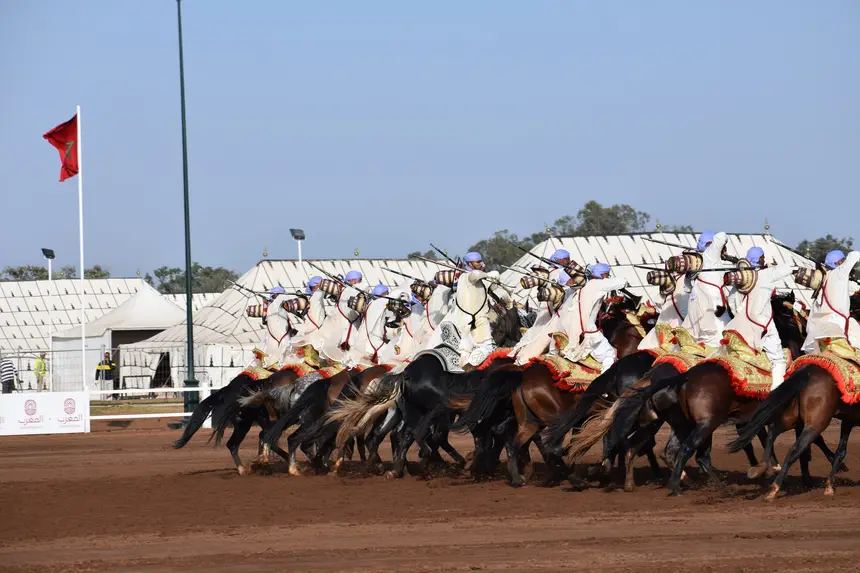 Tbourida fantasia print — Moroccan horsemen charging through gunpowder smoke (BWK-388), photograph by Saida