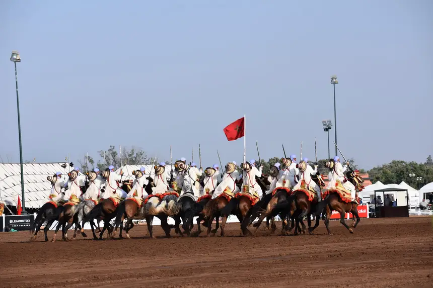 Tbourida fantasia print — Moroccan horsemen charging through gunpowder smoke (BWK-390), photograph by Saida
