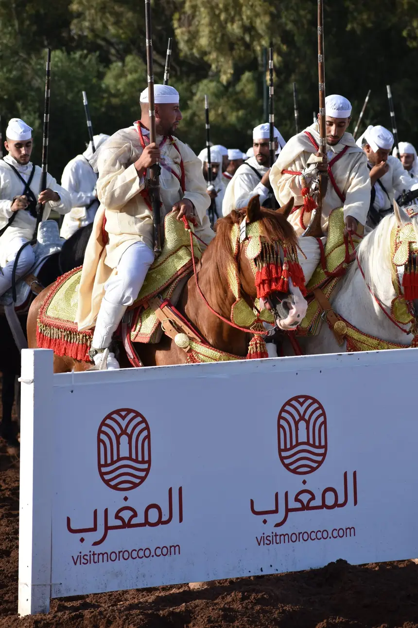 Tbourida fantasia print — Moroccan horsemen charging through gunpowder smoke (BWK-395), photograph by Saida