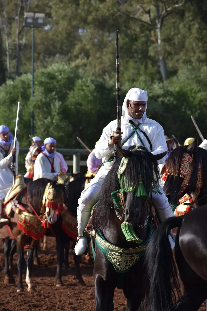 Tbourida fantasia print — Moroccan horsemen charging through gunpowder smoke (BWK-406), photograph by Saida