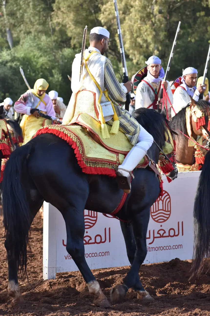 Tbourida fantasia print — Moroccan horsemen charging through gunpowder smoke (BWK-415), photograph by Saida