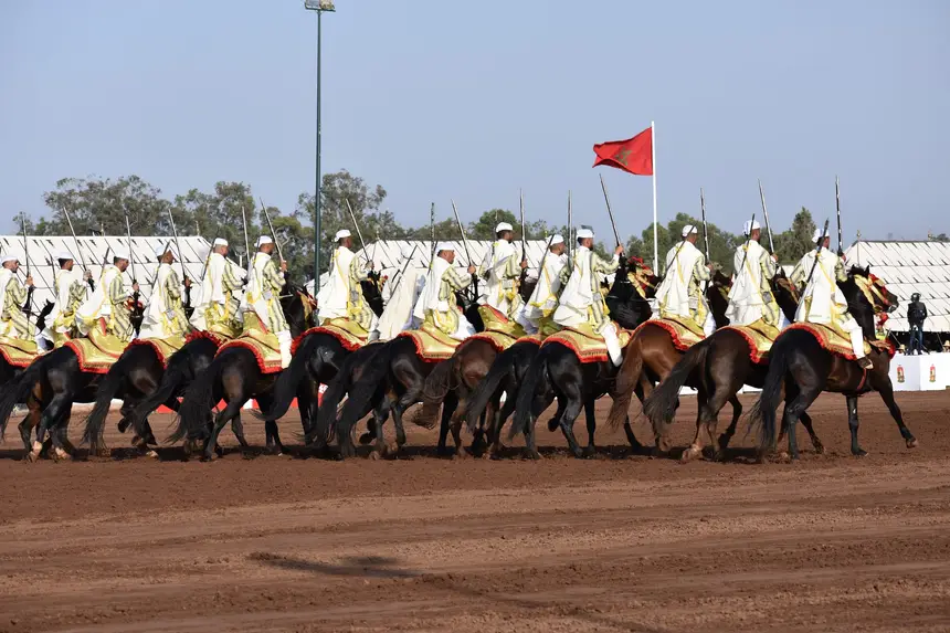 Tbourida fantasia print — Moroccan horsemen charging through gunpowder smoke (BWK-419), photograph by Saida