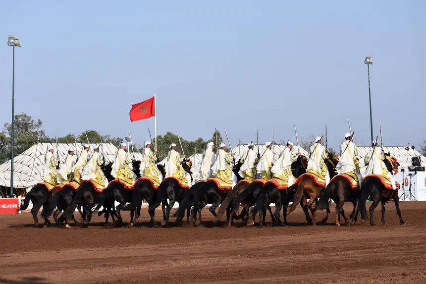 Tbourida fantasia print — Moroccan horsemen charging through gunpowder smoke (BWK-420), photograph by Saida