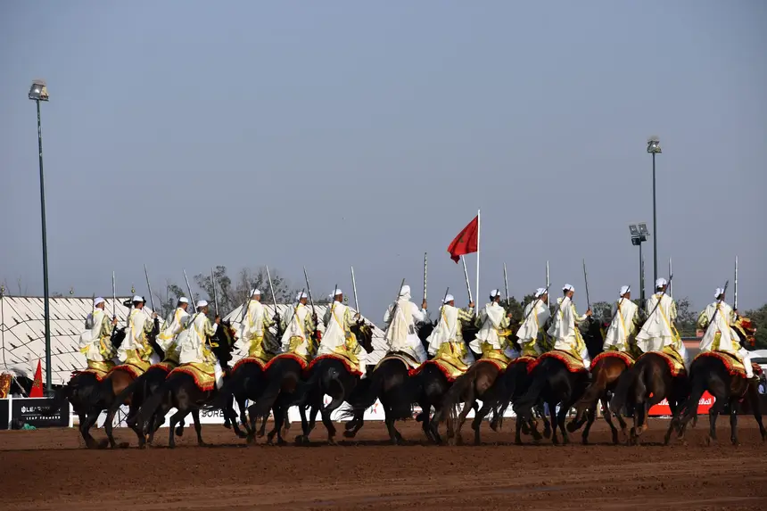 Tbourida fantasia print — Moroccan horsemen charging through gunpowder smoke (BWK-421), photograph by Saida