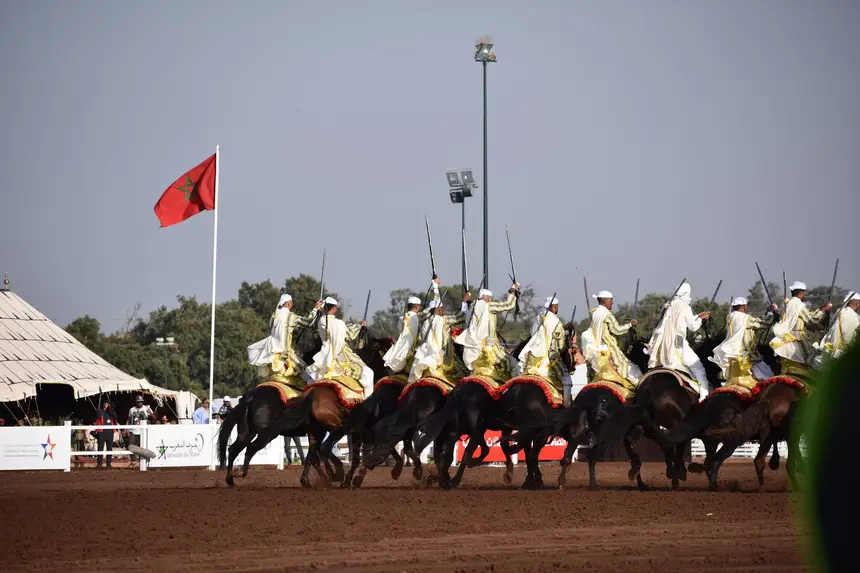 Tbourida fantasia print — Moroccan horsemen charging through gunpowder smoke (BWK-423), photograph by Saida