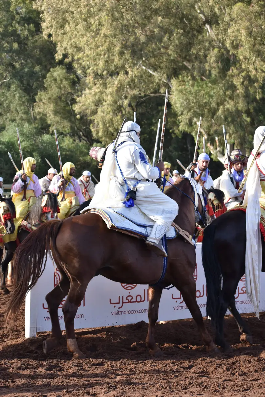 Tbourida fantasia print — Moroccan horsemen charging through gunpowder smoke (BWK-428), photograph by Saida