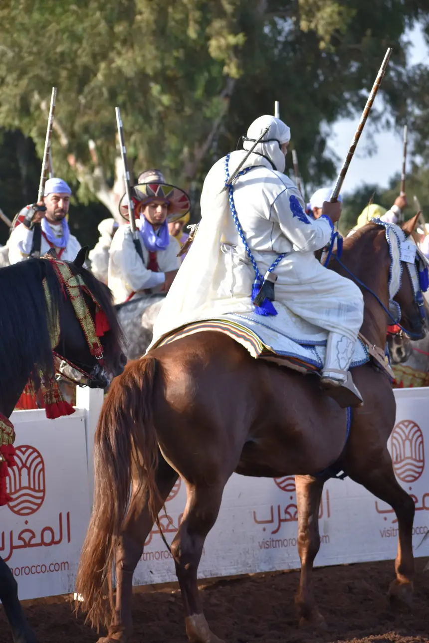 Tbourida fantasia print — Moroccan horsemen charging through gunpowder smoke (BWK-429), photograph by Saida