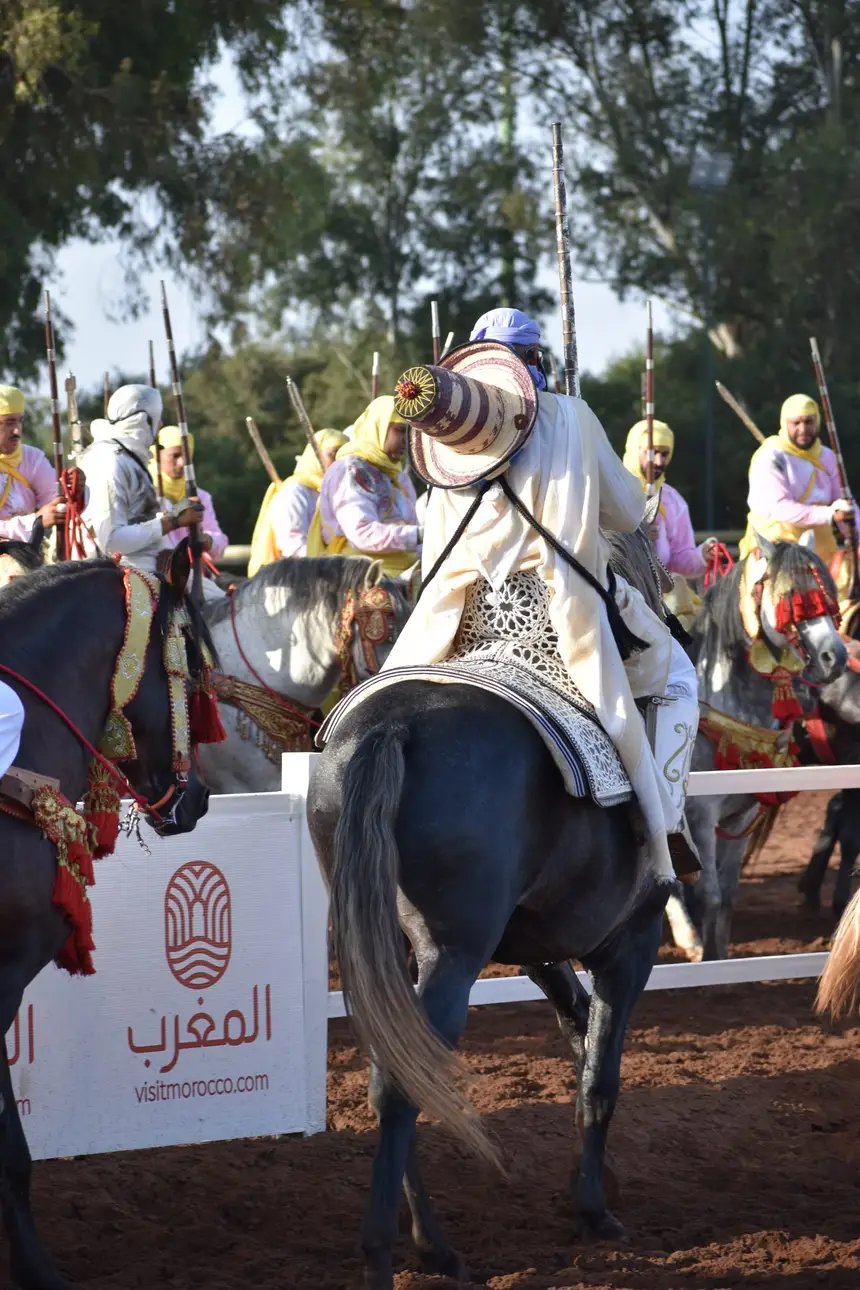 Tbourida fantasia print — Moroccan horsemen charging through gunpowder smoke (BWK-444), photograph by Saida
