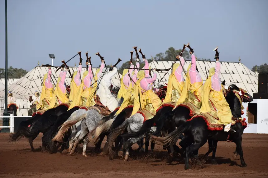 Tbourida fantasia print — Moroccan horsemen charging through gunpowder smoke (BWK-449), photograph by Saida