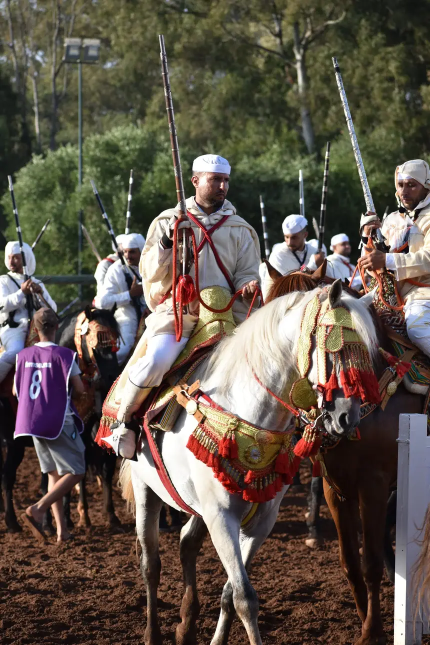 Tbourida fantasia print — Moroccan horsemen charging through gunpowder smoke (BWK-454), photograph by Saida