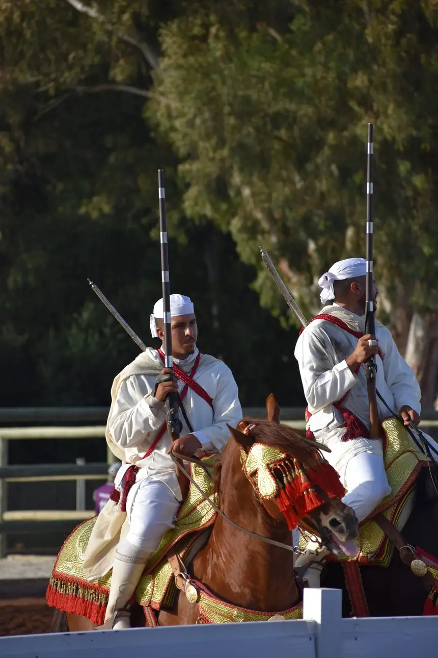 Tbourida fantasia print — Moroccan horsemen charging through gunpowder smoke (BWK-462), photograph by Saida