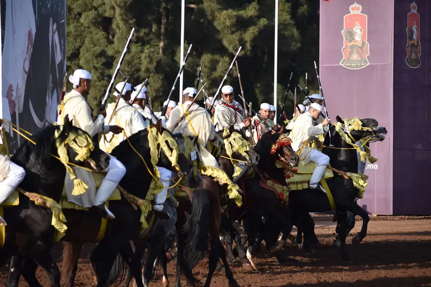 Tbourida fantasia print — Moroccan horsemen charging through gunpowder smoke (BWK-467), photograph by Saida