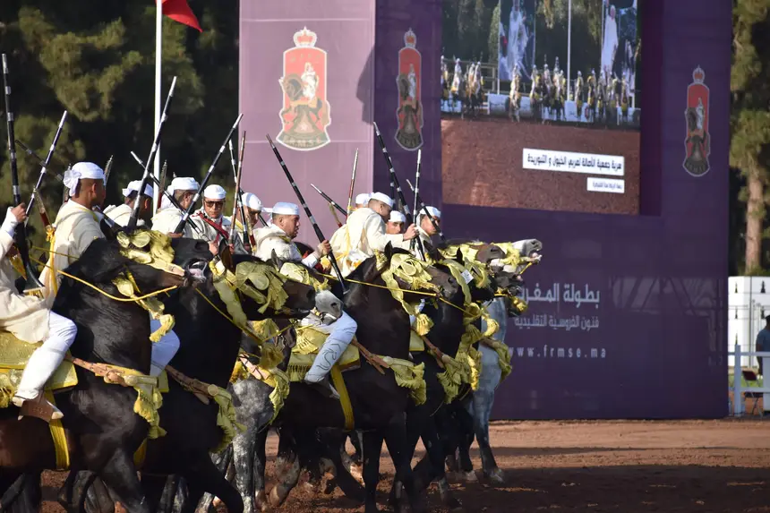 Tbourida fantasia print — Moroccan horsemen charging through gunpowder smoke (BWK-468), photograph by Saida