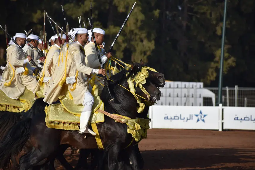 Tbourida fantasia print — Moroccan horsemen charging through gunpowder smoke (BWK-470), photograph by Saida