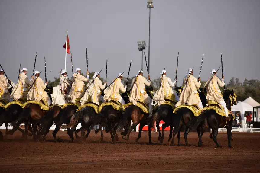 Tbourida fantasia print — Moroccan horsemen charging through gunpowder smoke (BWK-472), photograph by Saida