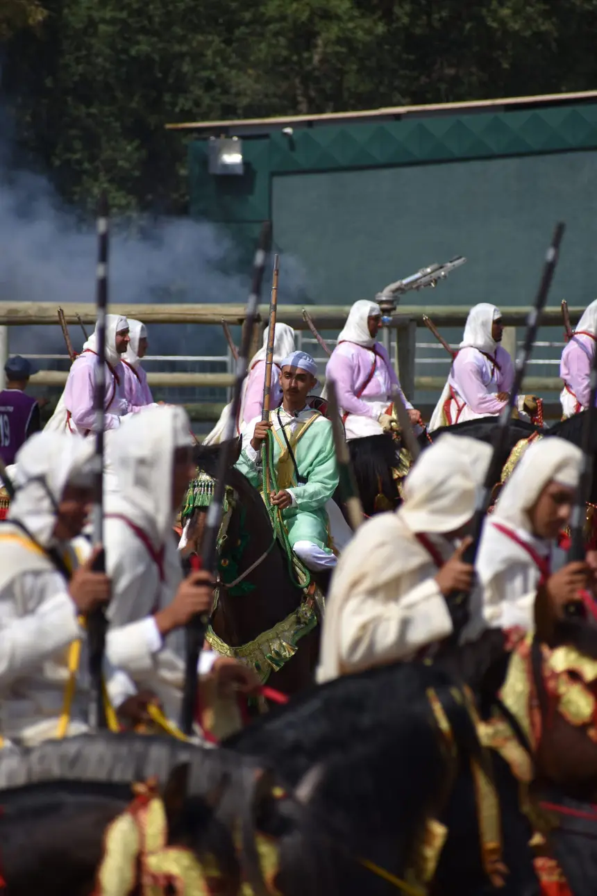 Tbourida fantasia print — Moroccan horsemen charging through gunpowder smoke (BWK-485), photograph by Saida