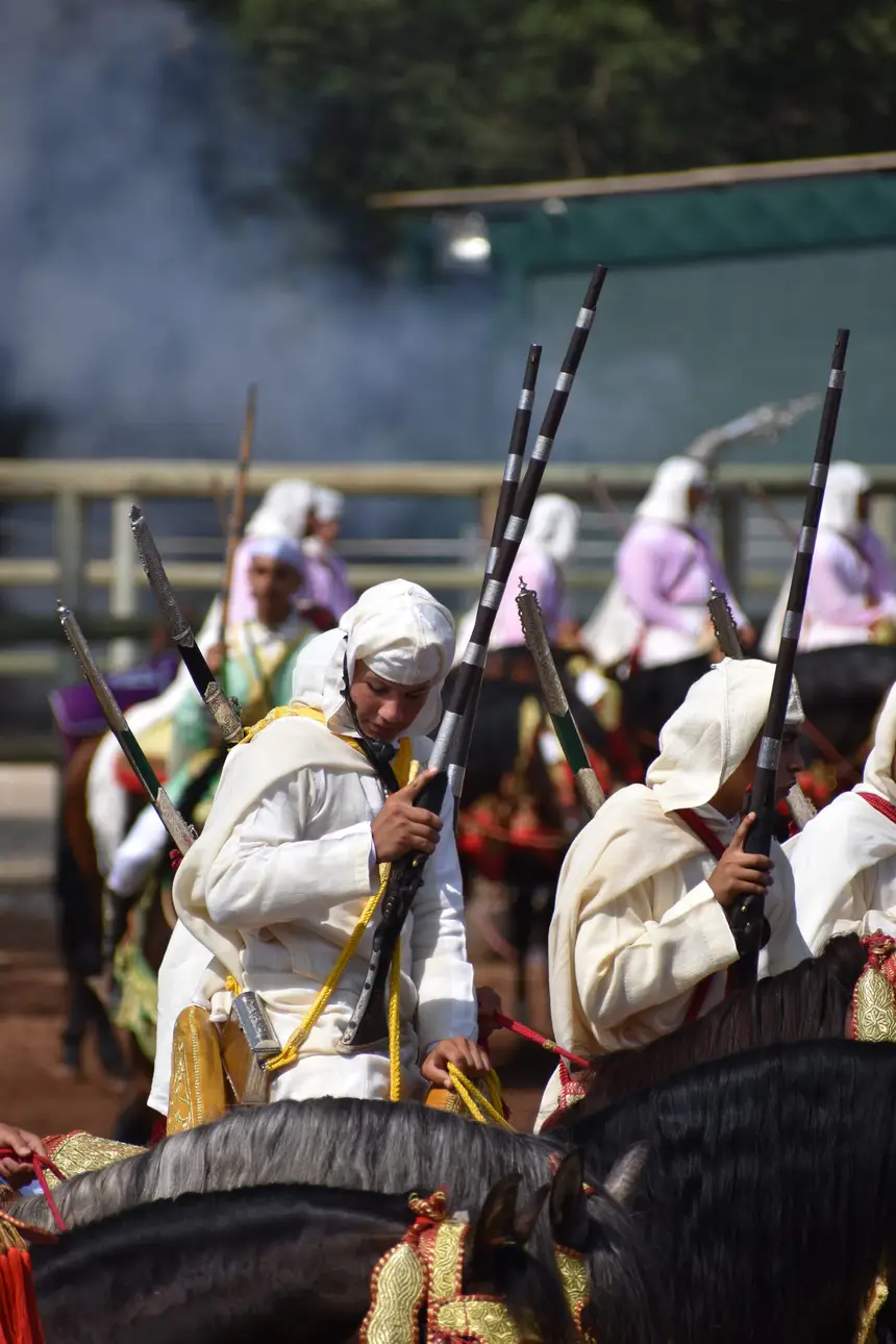 Tbourida fantasia print — Moroccan horsemen charging through gunpowder smoke (BWK-486), photograph by Saida