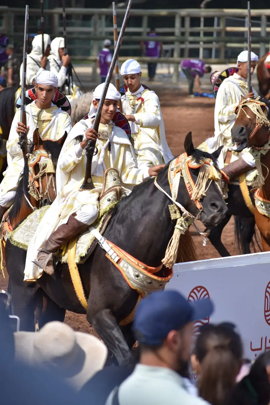 Tbourida fantasia print — Moroccan horsemen charging through gunpowder smoke (BWK-496), photograph by Saida