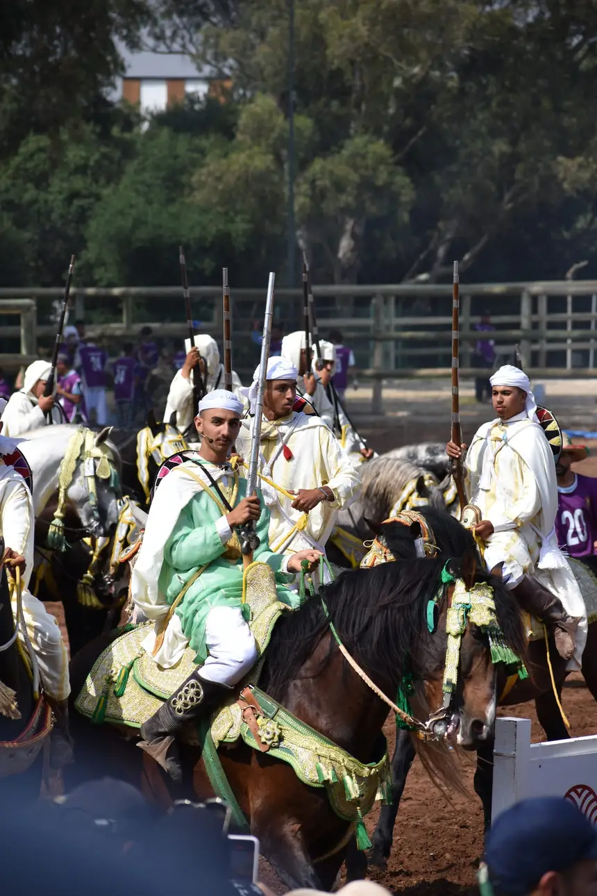 Tbourida fantasia print — Moroccan horsemen charging through gunpowder smoke (BWK-497), photograph by Saida