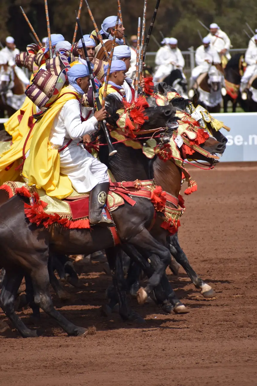Tbourida fantasia print — Moroccan horsemen charging through gunpowder smoke (BWK-517), photograph by Saida