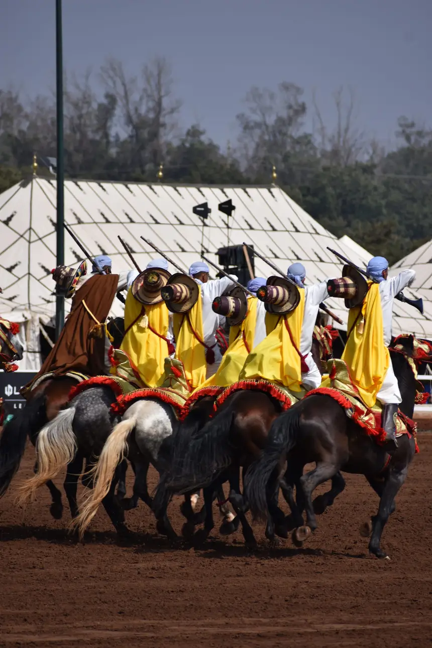 Tbourida fantasia print — Moroccan horsemen charging through gunpowder smoke (BWK-519), photograph by Saida