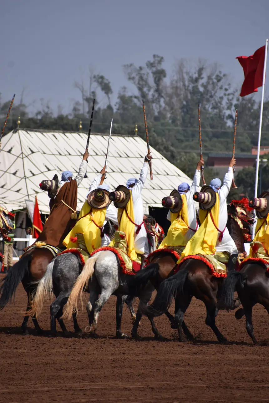 Tbourida fantasia print — Moroccan horsemen charging through gunpowder smoke (BWK-520), photograph by Saida