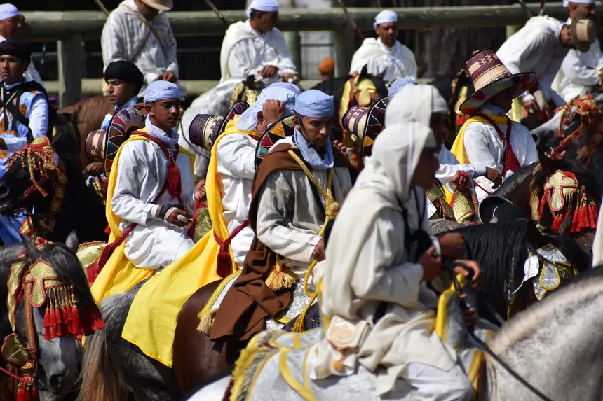 Tbourida fantasia print — Moroccan horsemen charging through gunpowder smoke (BWK-532), photograph by Saida