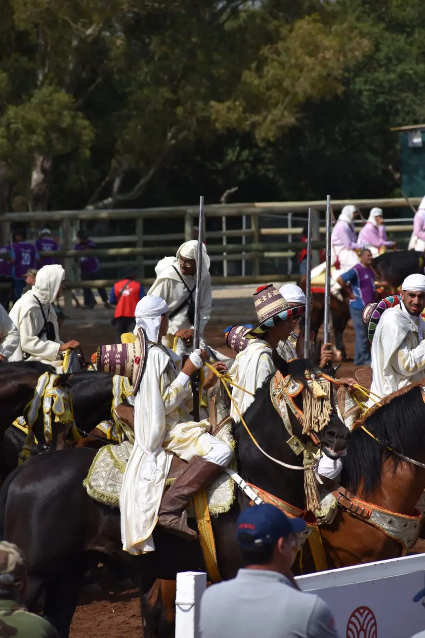 Tbourida fantasia print — Moroccan horsemen charging through gunpowder smoke (BWK-534), photograph by Saida