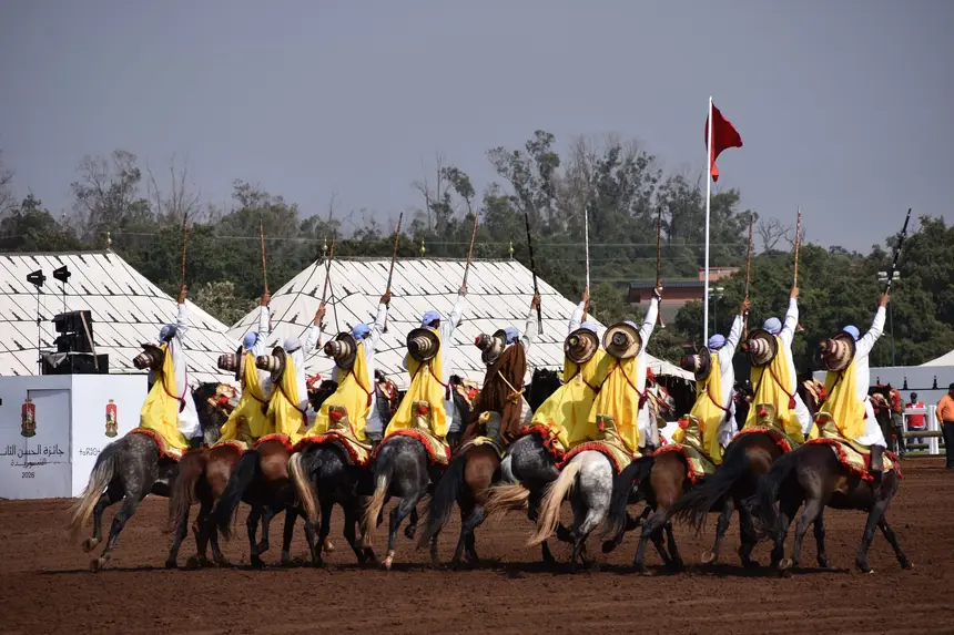 Tbourida fantasia print — Moroccan horsemen charging through gunpowder smoke (BWK-544), photograph by Saida
