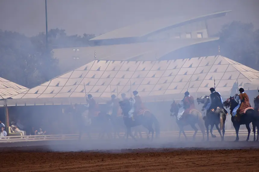 Tbourida fantasia print — Moroccan horsemen charging through gunpowder smoke (BWK-552), photograph by Saida