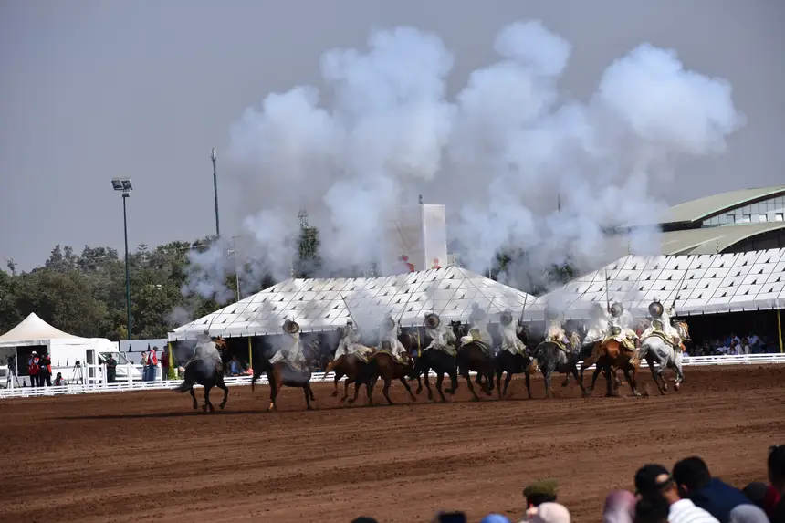 Tbourida fantasia print — Moroccan horsemen charging through gunpowder smoke (BWK-570), photograph by Saida