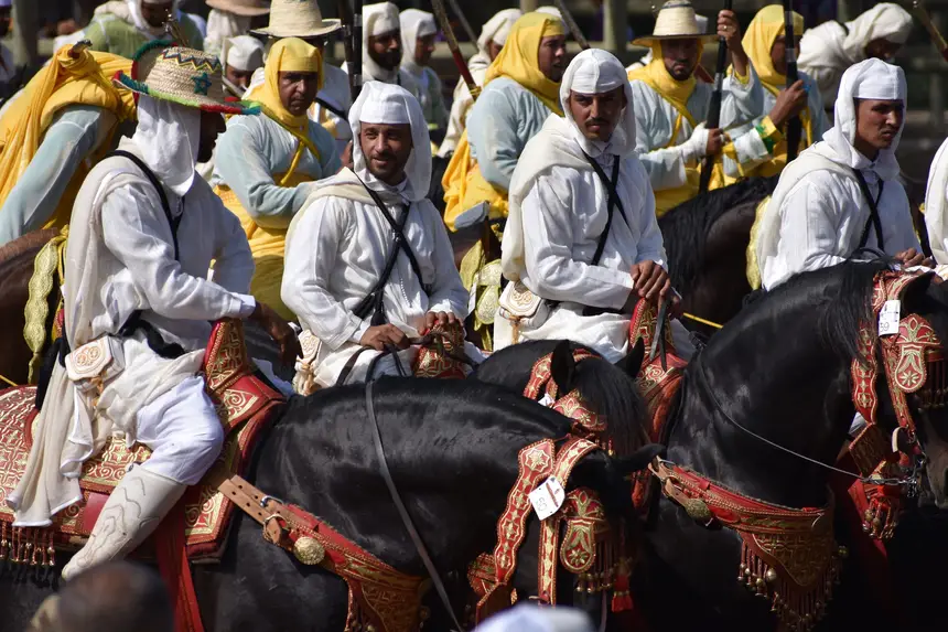 Tbourida fantasia print — Moroccan horsemen charging through gunpowder smoke (BWK-591), photograph by Saida