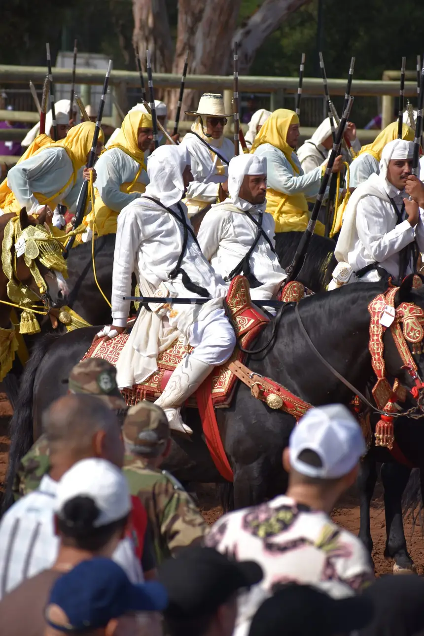 Tbourida fantasia print — Moroccan horsemen charging through gunpowder smoke (BWK-606), photograph by Saida