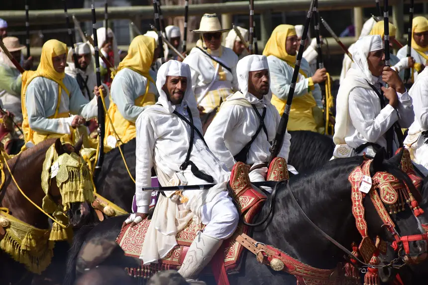 Tbourida fantasia print — Moroccan horsemen charging through gunpowder smoke (BWK-609), photograph by Saida