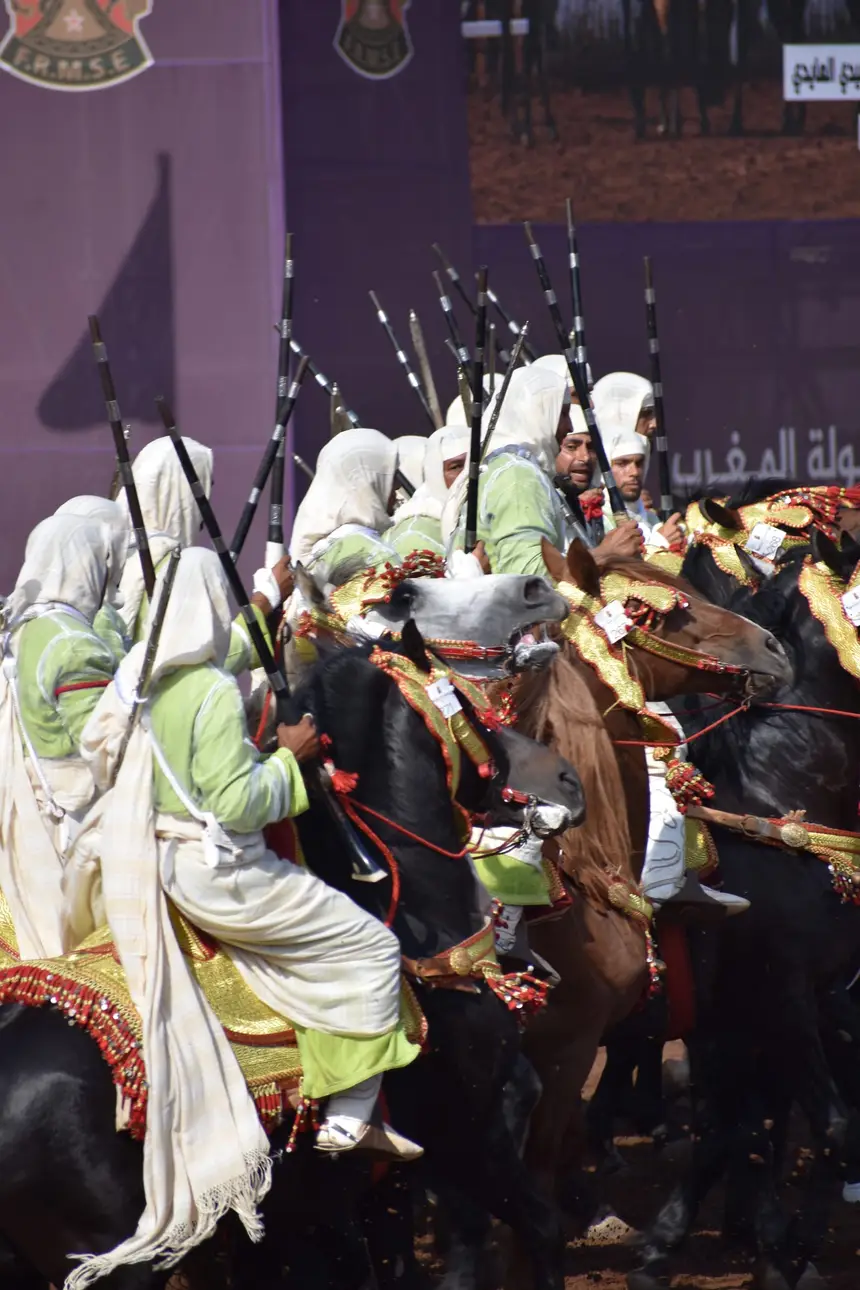 Tbourida fantasia print — Moroccan horsemen charging through gunpowder smoke (BWK-645), photograph by Saida