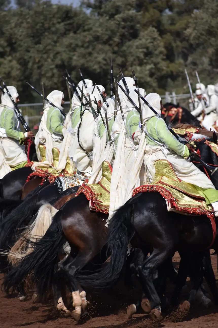 Tbourida fantasia print — Moroccan horsemen charging through gunpowder smoke (BWK-648), photograph by Saida