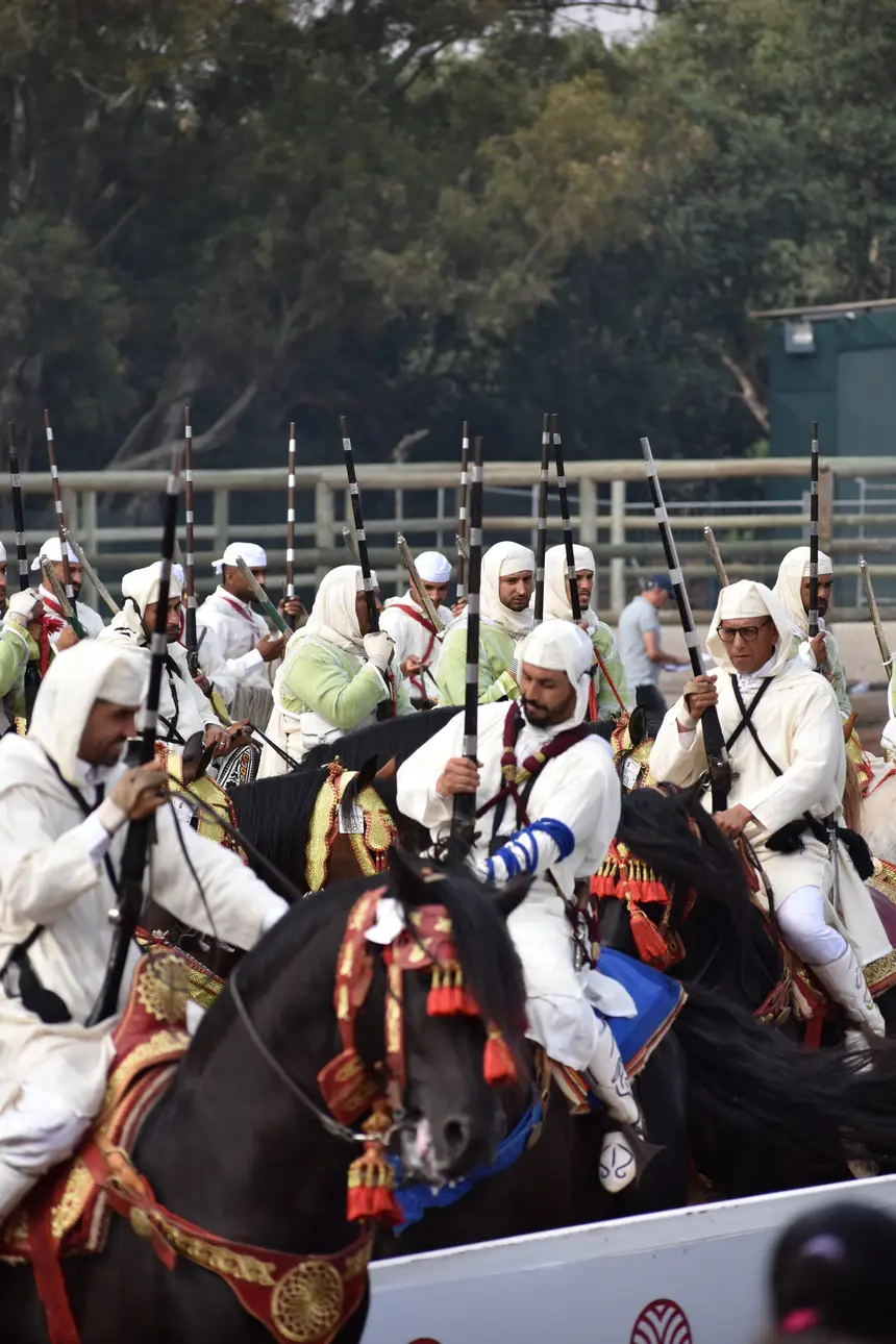 Tbourida fantasia print — Moroccan horsemen charging through gunpowder smoke (BWK-676), photograph by Saida