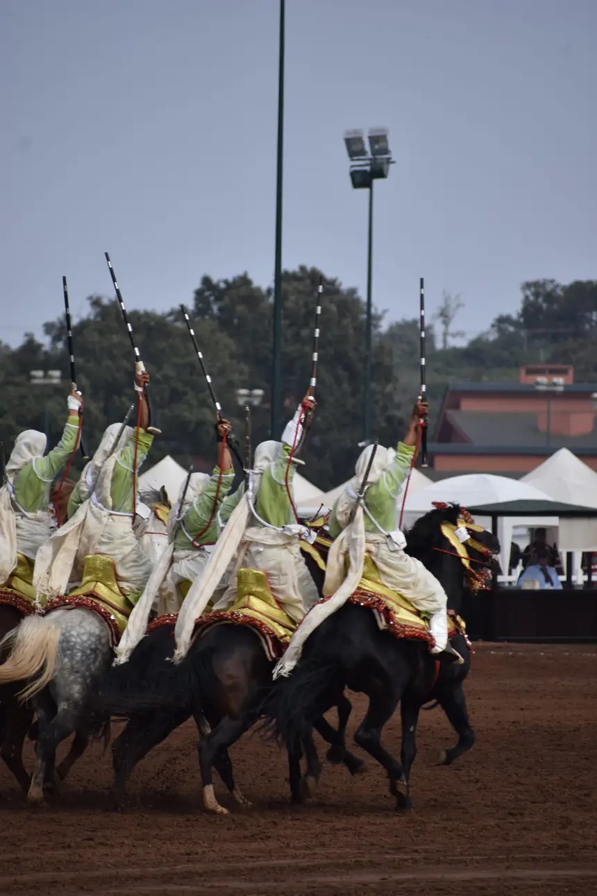 Tbourida fantasia print — Moroccan horsemen charging through gunpowder smoke (BWK-683), photograph by Saida
