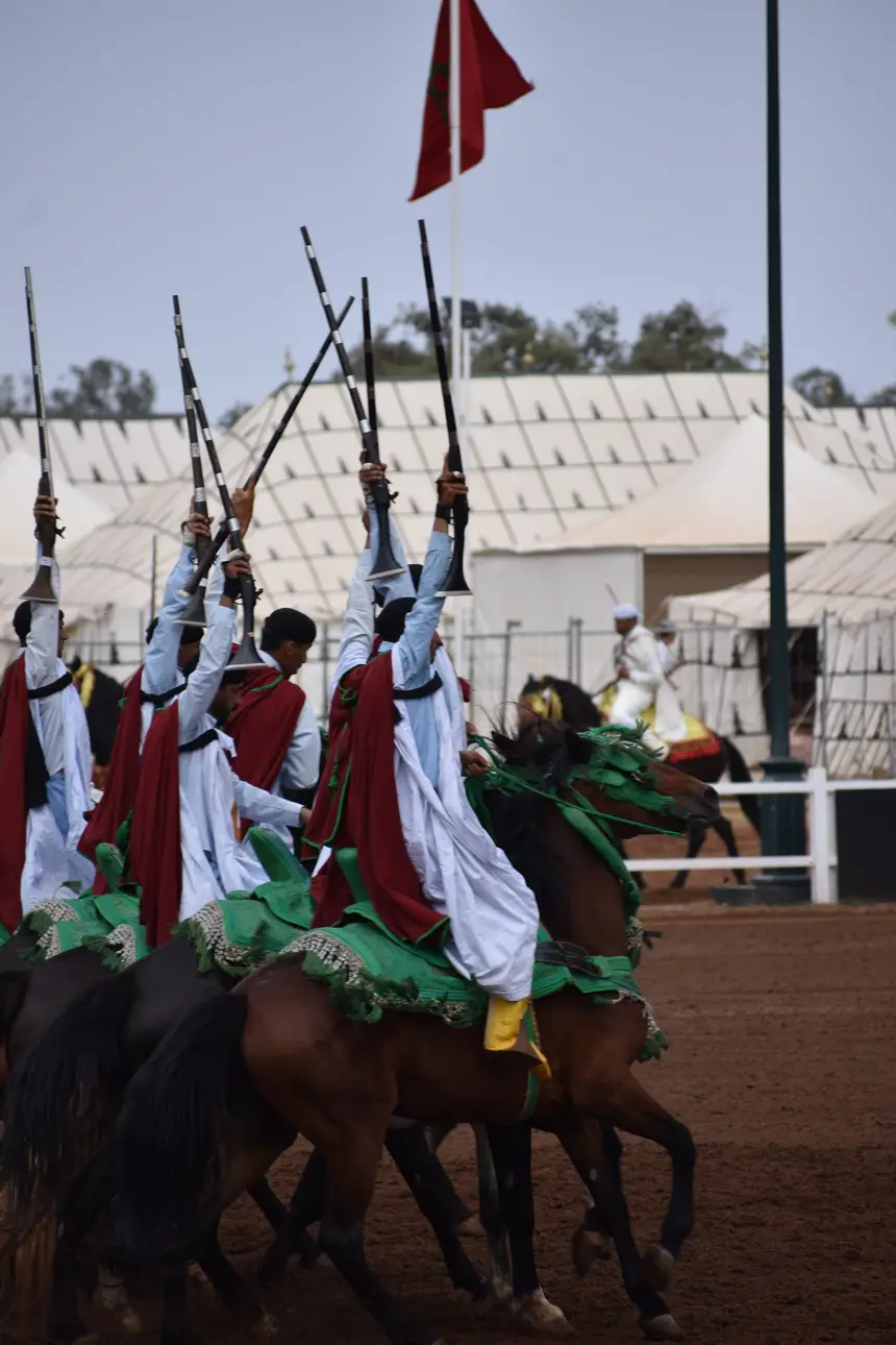 Tbourida fantasia print — Moroccan horsemen charging through gunpowder smoke (BWK-696), photograph by Saida
