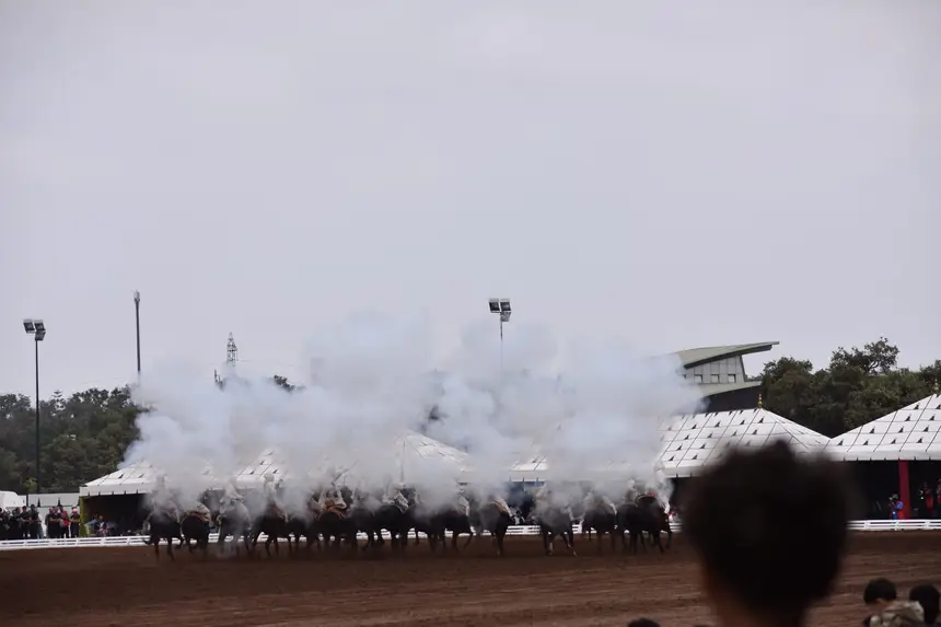 Tbourida fantasia print — Moroccan horsemen charging through gunpowder smoke (BWK-702), photograph by Saida