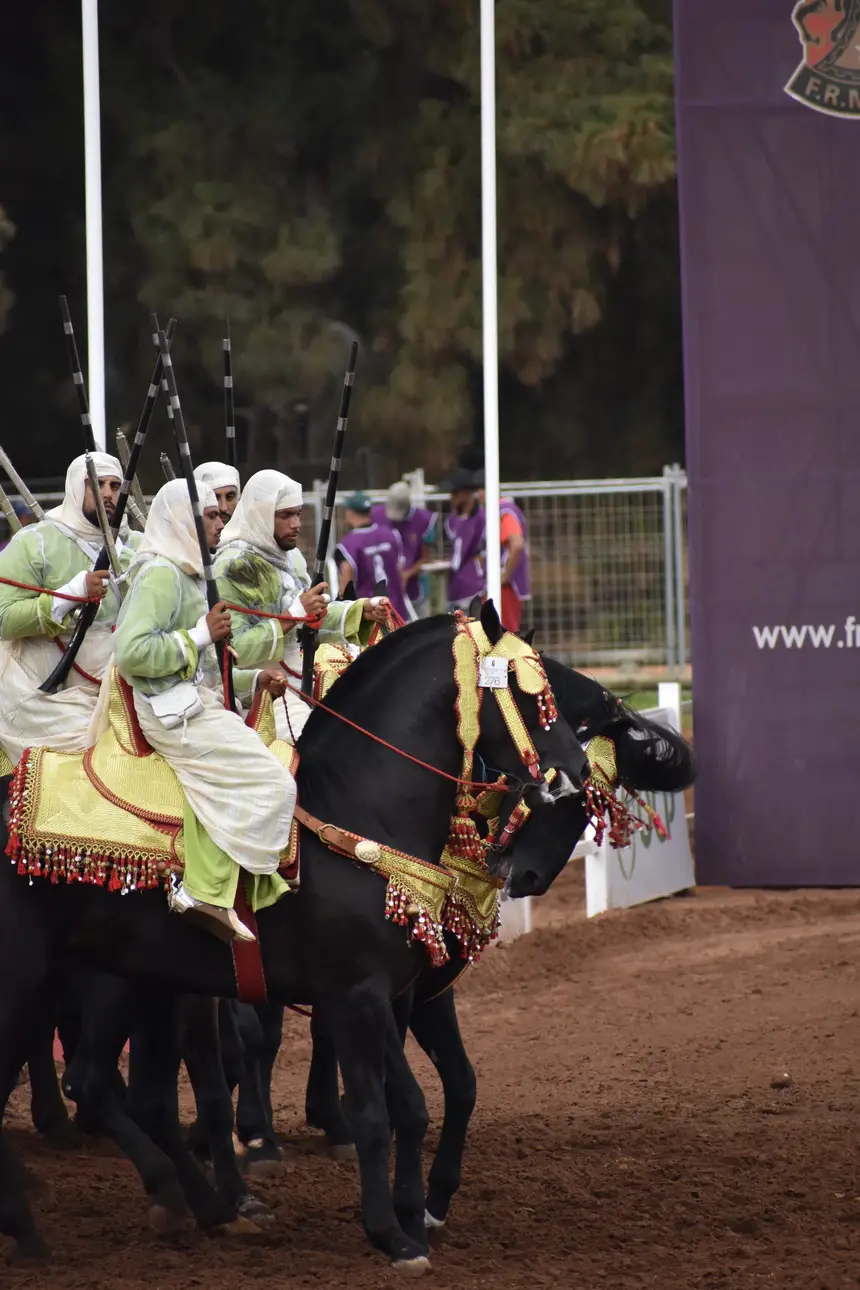 Tbourida fantasia print — Moroccan horsemen charging through gunpowder smoke (BWK-710), photograph by Saida
